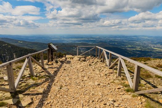 View platform with panorama of Giant Mountains next to trail to Sniezka