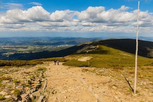 Long mountain trail with panorama of Karkonosze Giant Mountains around