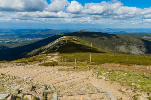 Long mountain trail with panorama of Karkonosze Giant Mountains around