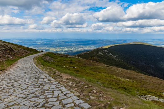 Long mountain trail with panorama of Karkonosze Giant Mountains around