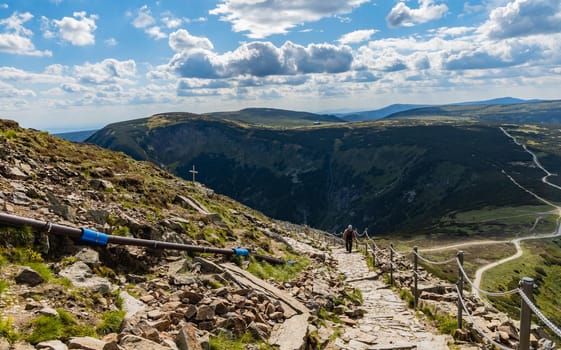 Long mountain trail with panorama of Karkonosze Giant Mountains around