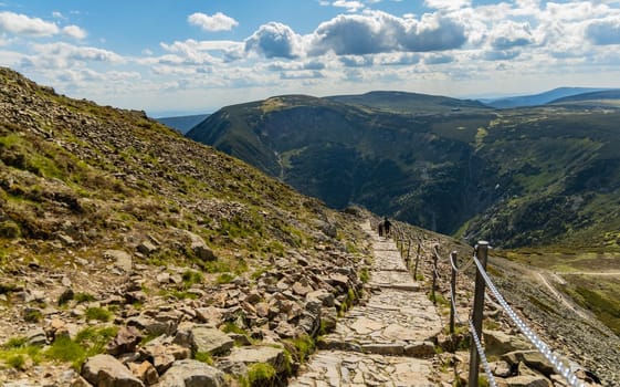 Long mountain trail with panorama of Karkonosze Giant Mountains around