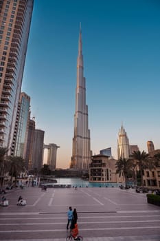 Dec 14th 2020, Dubai, UAE. View of the Burj Park with tourists and residents at evening time with Burj Khalifa in the background captured at Dubai, UAE.