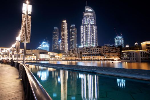 14th dec 2020,Dubai,UAE . Beautiful view of the illuminated souk al bahar ,the dubai mall, the address hotel and other buildings captured at the Dubai mall, Dubai, UAE.