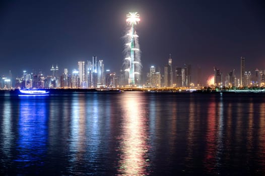 Jan 1st,2021, Dubai,uae. VIEW OF THE SPECTACULAR FIREWORKS AT THE BURJ KHALIFA ILLUMINATED WITH THE UAE FLAG COLORS DURING THE NEW YEAR 2021 CELEBRATION CAPTURED FROM THE CREEK HARBOR , DUBAI , UAE.