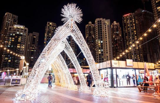JAN 7th 2021, DUBAI, UAE. Beautifully illuminated decorations for the Dubai shopping festival at the busy recreational etisalat dsf market at the burj park, Dubai,Uae.