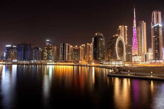 March 5th,2021, Dubai,UAE. Beautiful view of the illuminated sky scrapers along with Burj khalifa captured from the Marasi drive at the Business bay district, Dubai, UAE.