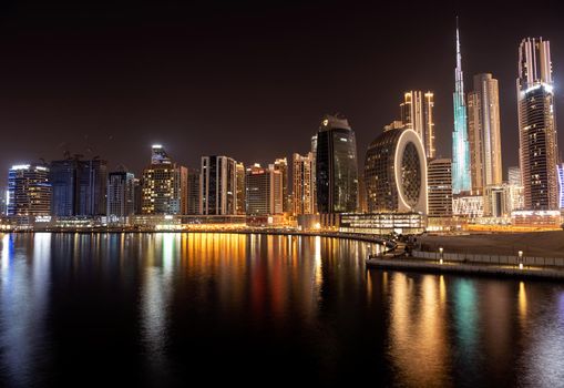 March 5th,2021, Dubai,UAE. Beautiful view of the illuminated sky scrapers along with Burj khalifa captured from the Marasi drive at the Business bay district, Dubai, UAE.