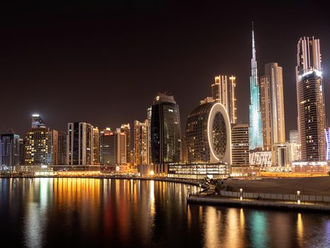 March 5th,2021, Dubai,UAE. Beautiful view of the illuminated sky scrapers along with Burj khalifa captured from the Marasi drive at the Business bay district, Dubai, UAE.