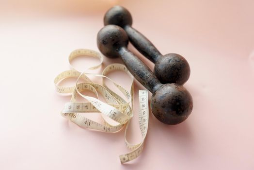 Diet Concept Slimming with Exercise, Black Drumbell on Floor, Fitness Sports