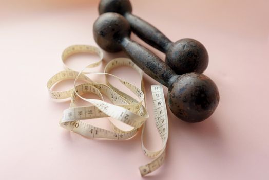 Diet Concept Slimming with Exercise, Black Drumbell on Floor, Fitness Sports
