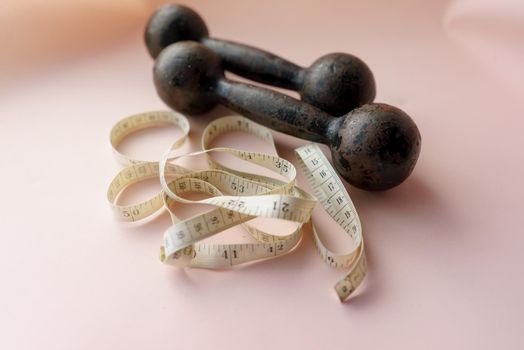 Diet Concept Slimming with Exercise, Black Drumbell on Floor, Fitness Sports