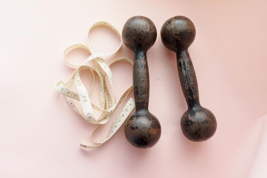 Diet Concept Slimming with Exercise, Black Drumbell on Floor, Fitness Sports