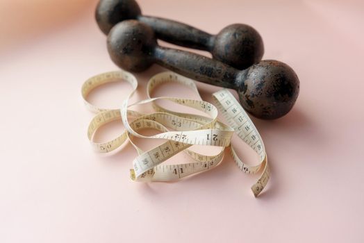 Diet Concept Slimming with Exercise, Black Drumbell on Floor, Fitness Sports
