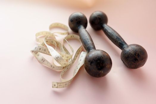 Diet Concept Slimming with Exercise, Black Drumbell on Floor, Fitness Sports