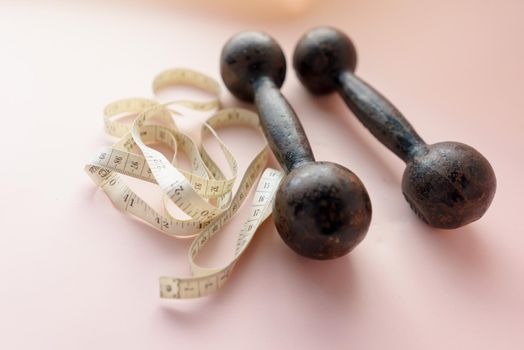 Diet Concept Slimming with Exercise, Black Drumbell on Floor, Fitness Sports