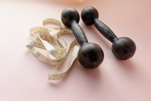 Diet Concept Slimming with Exercise, Black Drumbell on Floor, Fitness Sports