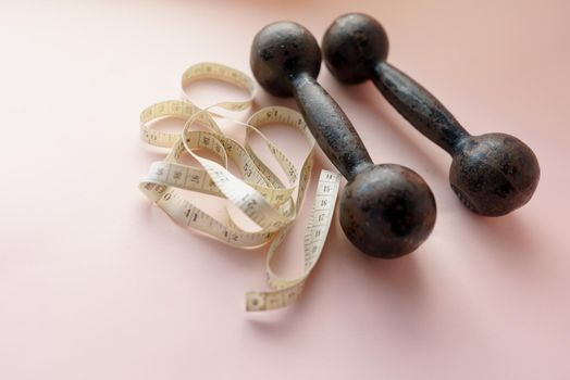 Diet Concept Slimming with Exercise, Black Drumbell on Floor, Fitness Sports