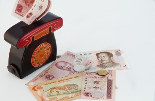 A cash piggy bank or purse with paper banknotes, Vietnamese money, isolated on a white background with a place for inscription. High quality photo