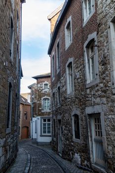 Narrow road with cobblestone pavement and historic buildings in Stolberg, Eifel, Germany