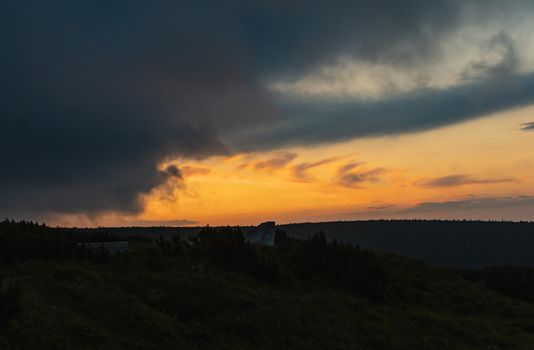 Cloudy sunset over panorama of Karkonosze Giant Mountain