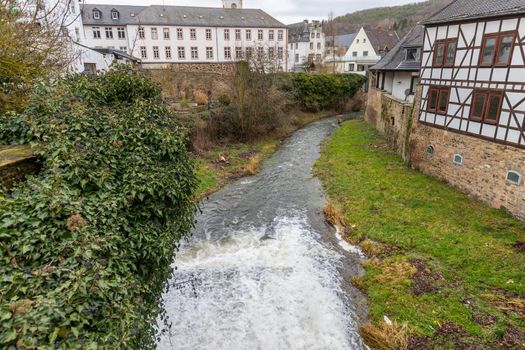 Historic buildings and Erft river in Bad Muenstereifel, Germany