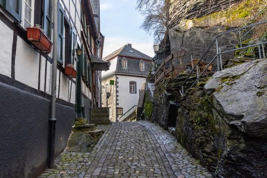 Paved narrow road with half-timbered houses in Monschau, Eifel, Germany