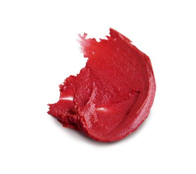 close up of a smudged lipstick on white background