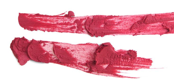 close up of a smudged lipstick on white background