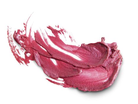 close up of a smudged lipstick on white background