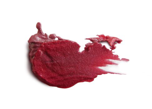 close up of a smudged lipstick on white background