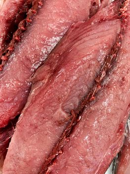 Tuna raw meat in a butcher shop, top view