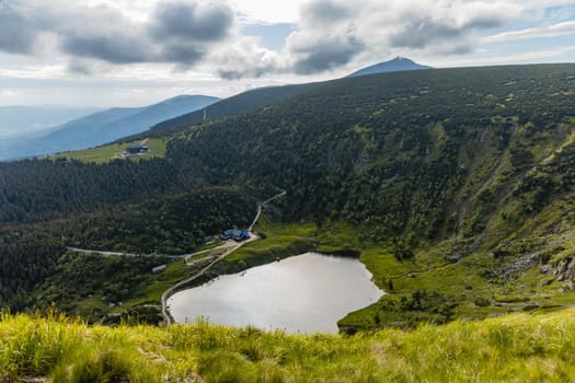 Small pond down to mountain trail in Giant Mountains next to Samotnia mountain shelter