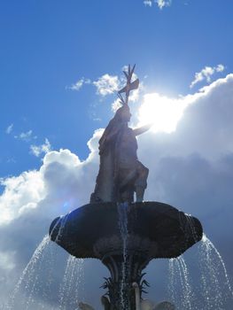 Statue of the Inca Pachacutec over the fountain at the Plaza de Armas in Cuzco, Peru