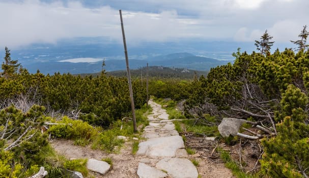 Long mountain trail with panorama of Karkonosze Giant Mountains around