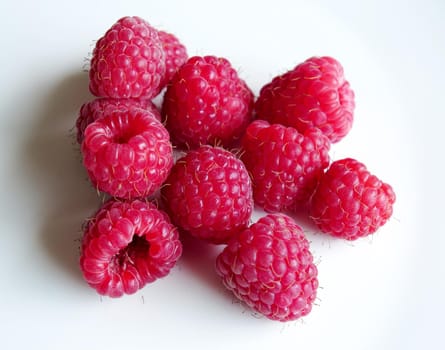 beautiful ripe raspberries on white background