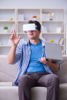 Freelance student with virtual reality glasses at home