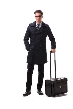 Young businessman with suitcase ready for business trip on white