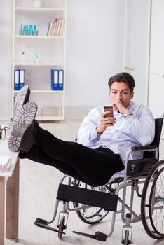 Doctor resting on wheelchair in hospital after night shift