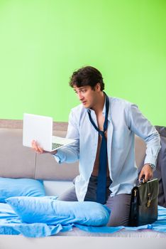 Employee in the bedroom being late for his job 