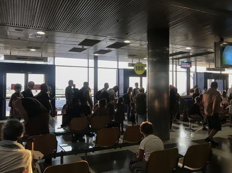 People with face protection prior to departure in International Airport Macedonia.