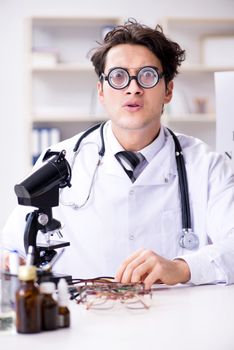 Funny eye doctor in humourous medical concept
