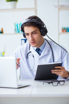 Male doctor listening to patient during telemedicine session