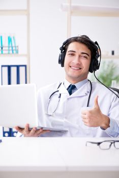 Male doctor listening to patient during telemedicine session