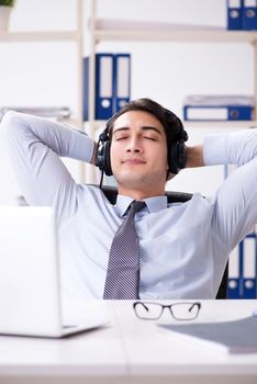 Sales assistant listening to music during lunch break