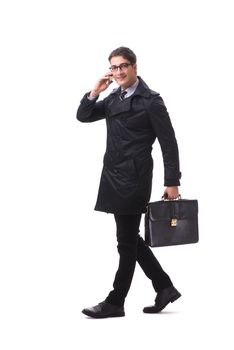Young businessman wearing winter coat isolated on white