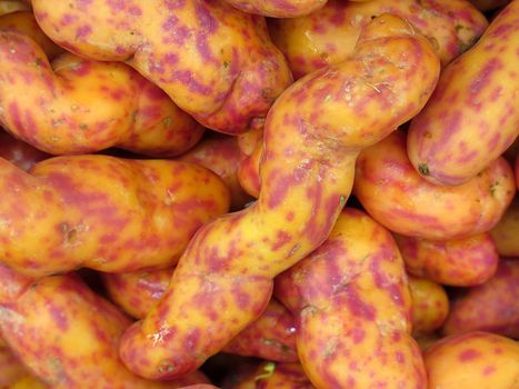 Red Olluquito. Peruvian tuber for sale at the Farmers Market