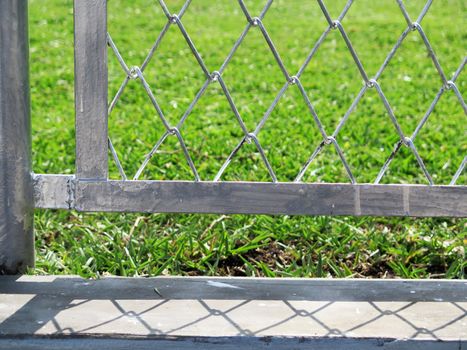 wire fence with grass out of focus background
