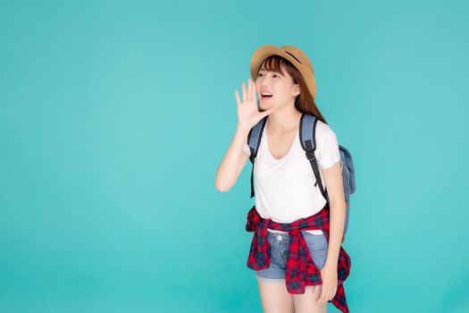 Beautiful young asian woman shouting sound loud with mouth for announce something in vacation travel with excited isolated on blue background, tourist asia girl journey in summer concept.