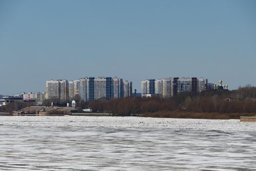 Spring ice on the river. City by the river. Nature, ecology. High quality photo